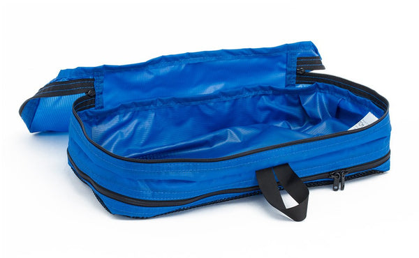 An empty and open Island (blue) Aether Small Aeronaut 45 Packing Cube open all-fabric side up.